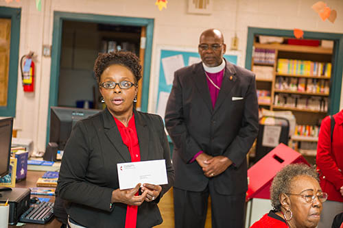 Mrs. Berlinda Mack, Principal of Greeleyville Elementary receives library money from The South Carolina United Methodist Church